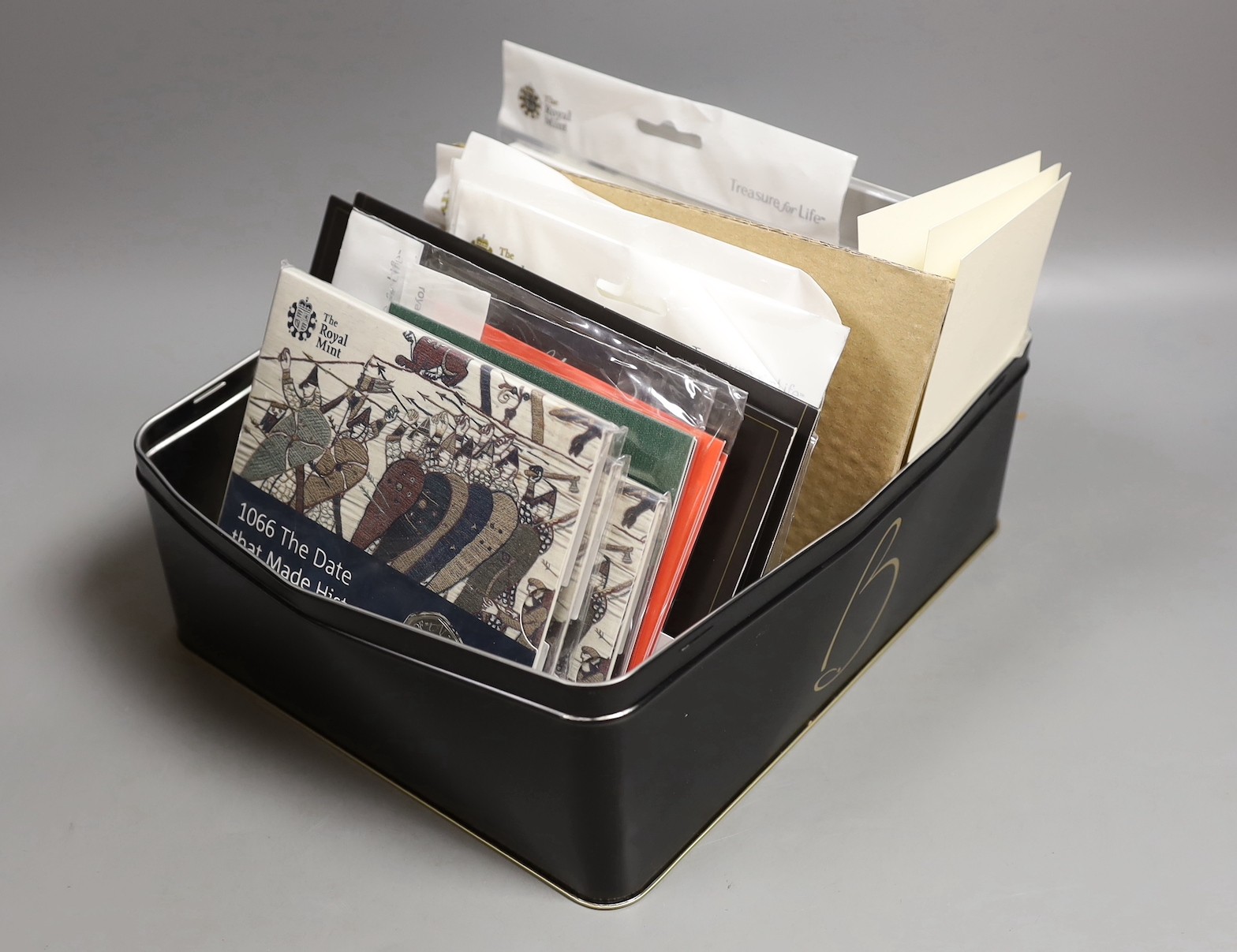 A collection of UK Royal mint brilliant uncirculated commemorative coins in presentation packs